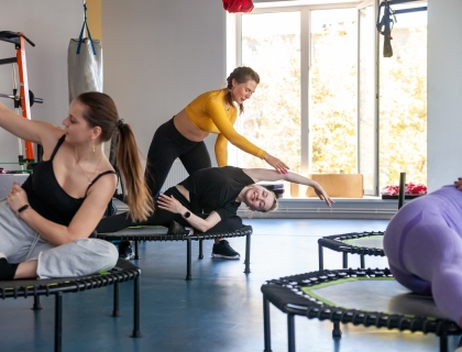 Trampoline for fitness girls engaged in professional sports, concept of healthy lifestyle jumping trampoline woman fitness sport training, from workout active in lifestyle from body trainer