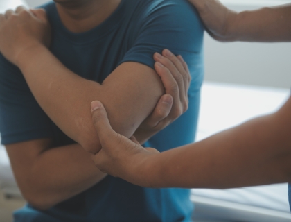 Physiotherapist working with patient in clinic, closeup